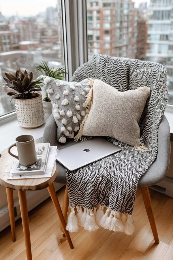 Small studio apartment with multifunctional furniture, soft textiles, and practical storage