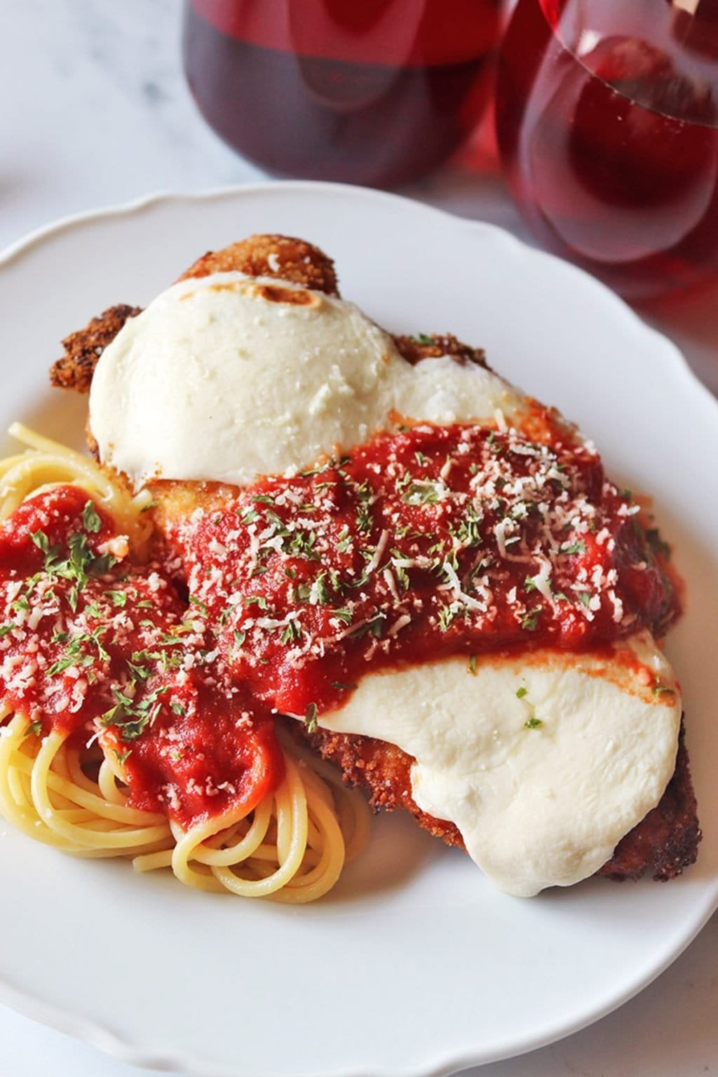 Chicken Parmesan with marinara and melted mozzarella