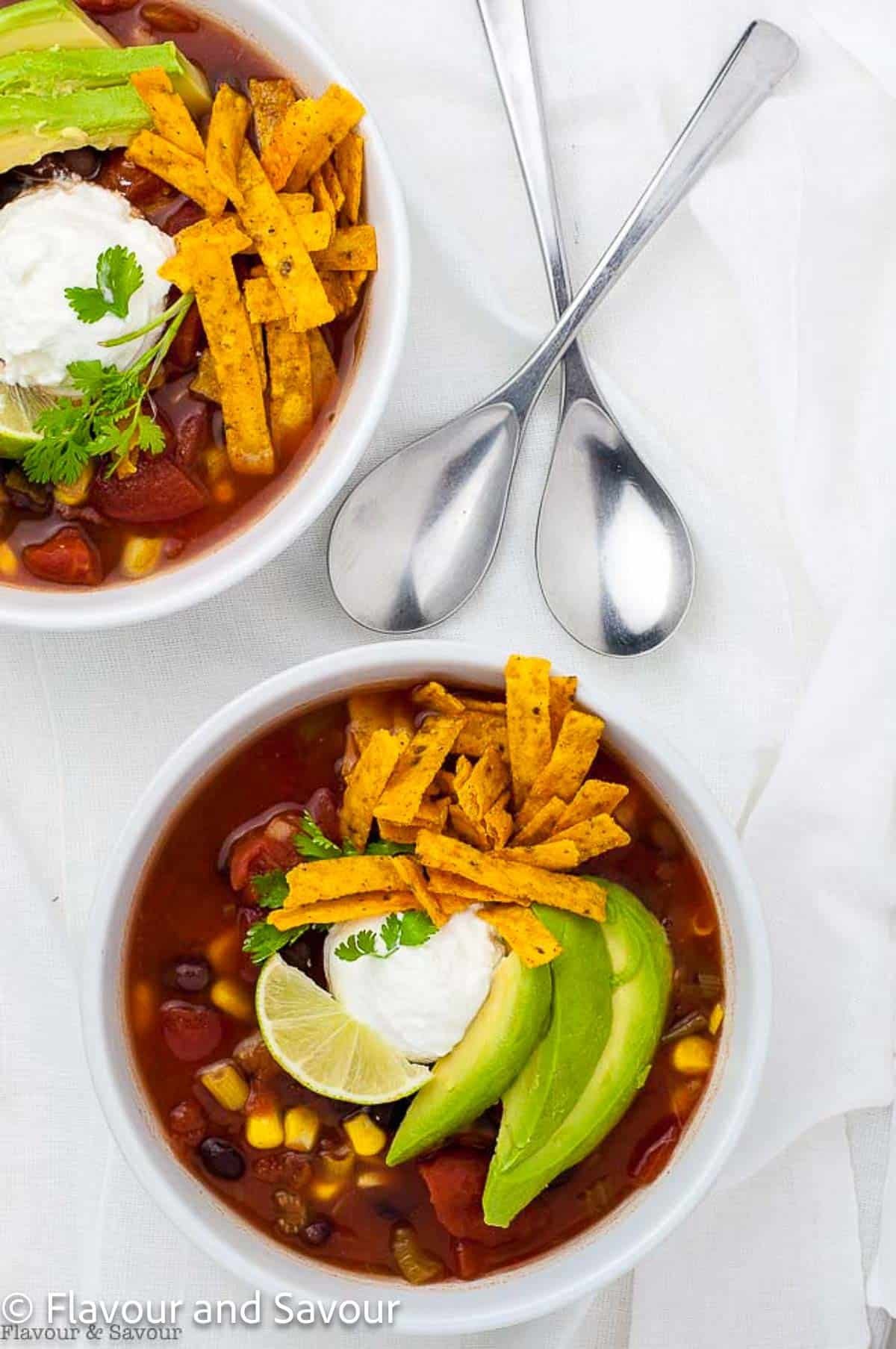Vegan black bean soup with avocado and cilantro