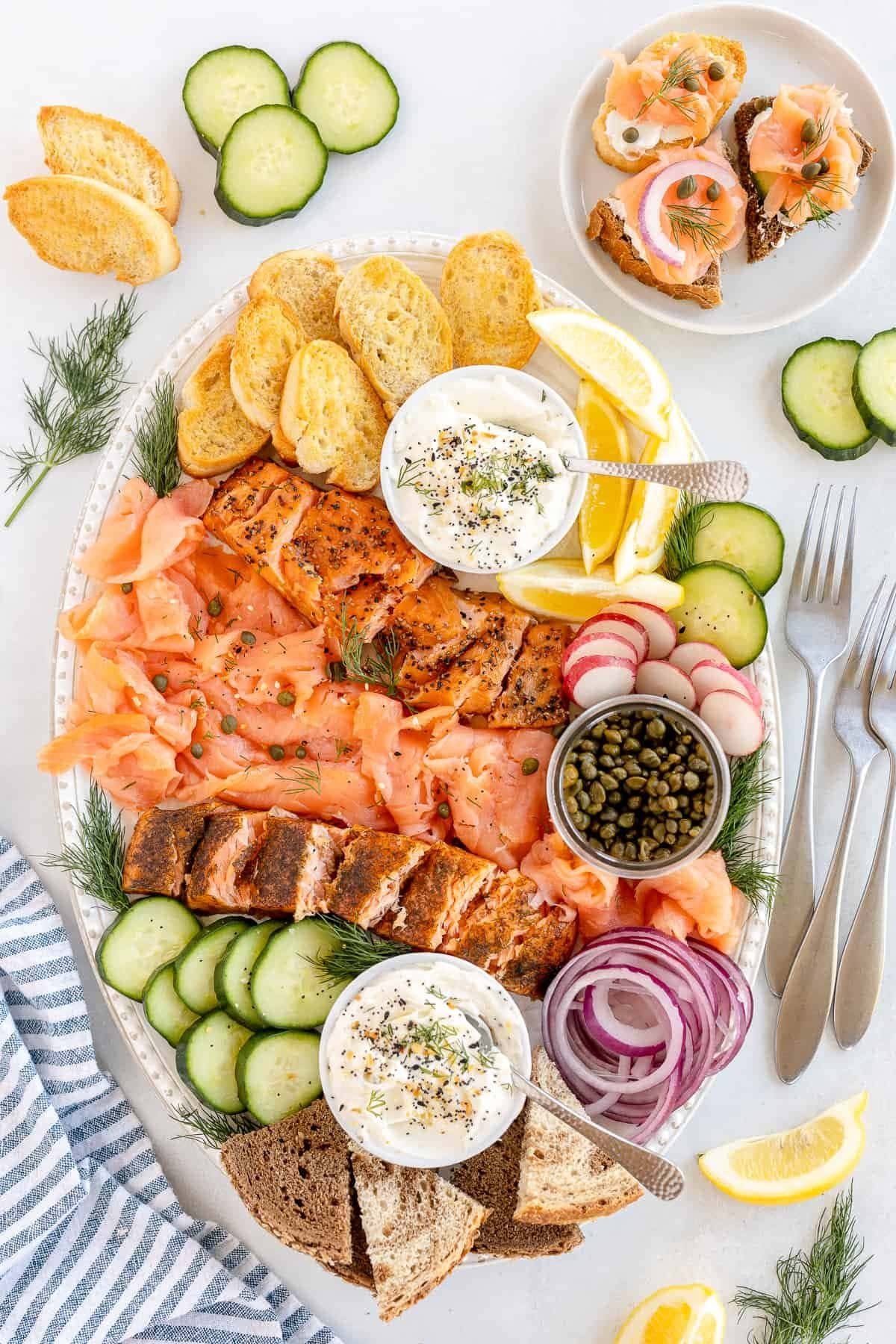 Smoked salmon platter with bagel chips and toppings