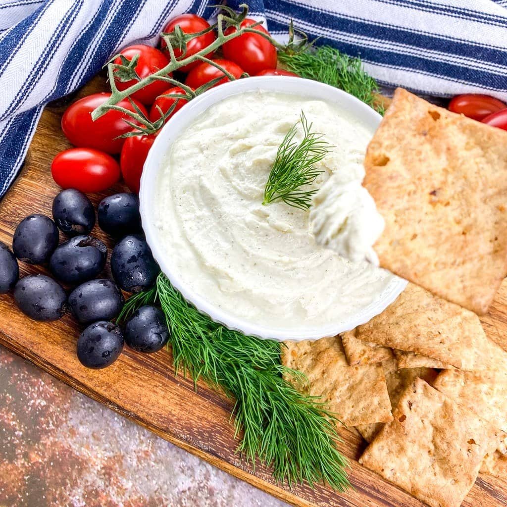 Whipped feta dip platter with olives and tomatoes
