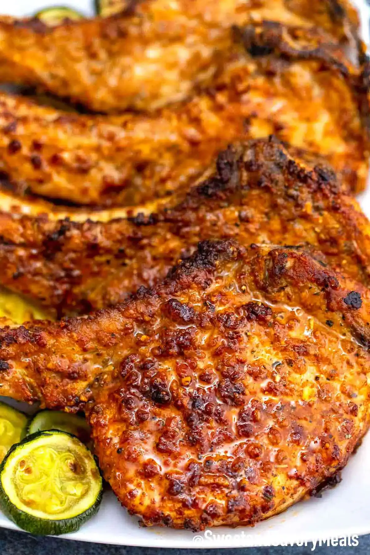 Golden breaded air fryer pork chops on a plate