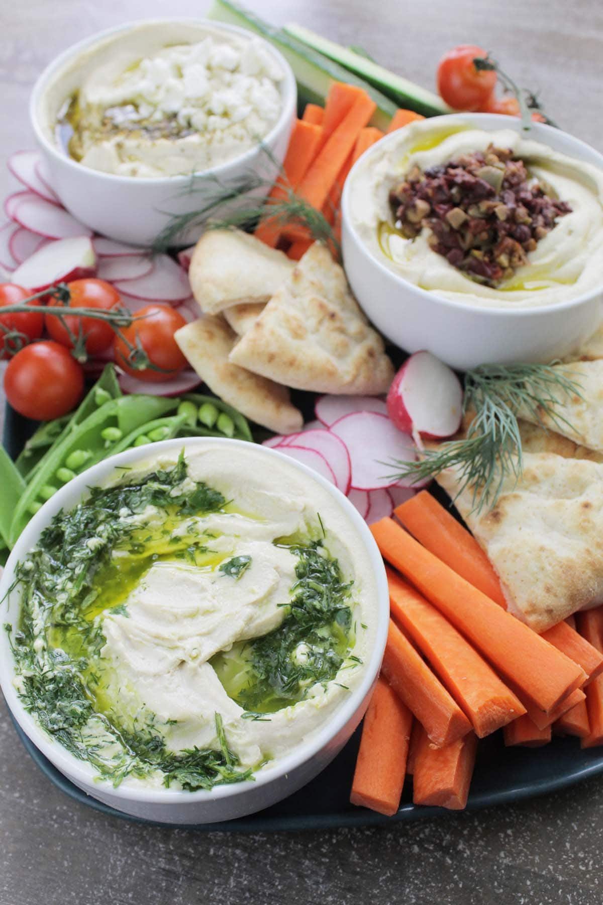 Mezze platter with hummus, pita, olives and vegetables