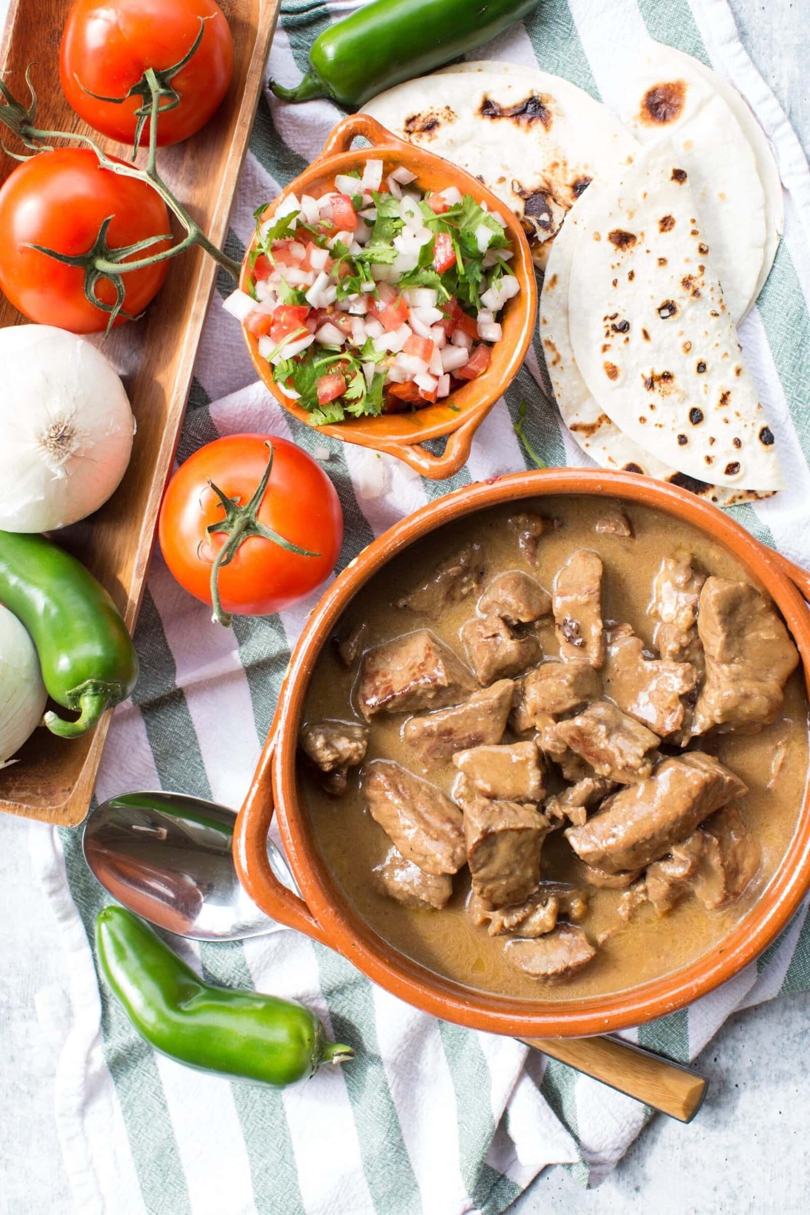 Carne guisada beef stew in rich gravy