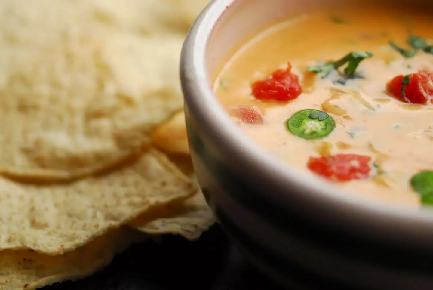 Bowl of chile con queso with tortilla chips
