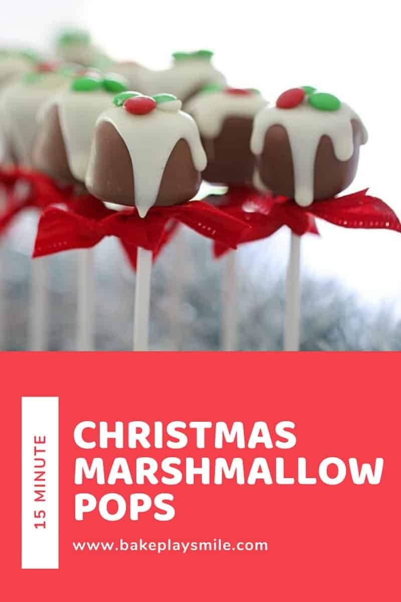 Christmas marshmallow pops dipped in chocolate and decorated with festive sprinkles