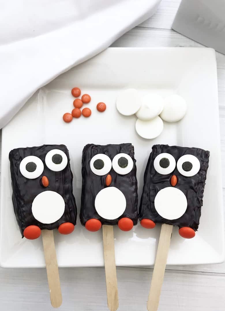 Penguin Rice Krispie treats decorated with chocolate and candy eyes