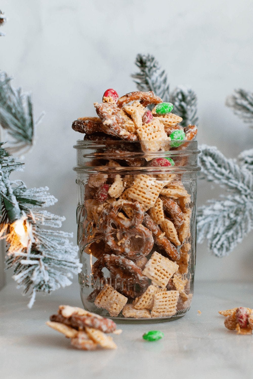 Christmas reindeer crack snack mix with pretzels, popcorn, chocolate and holiday candies