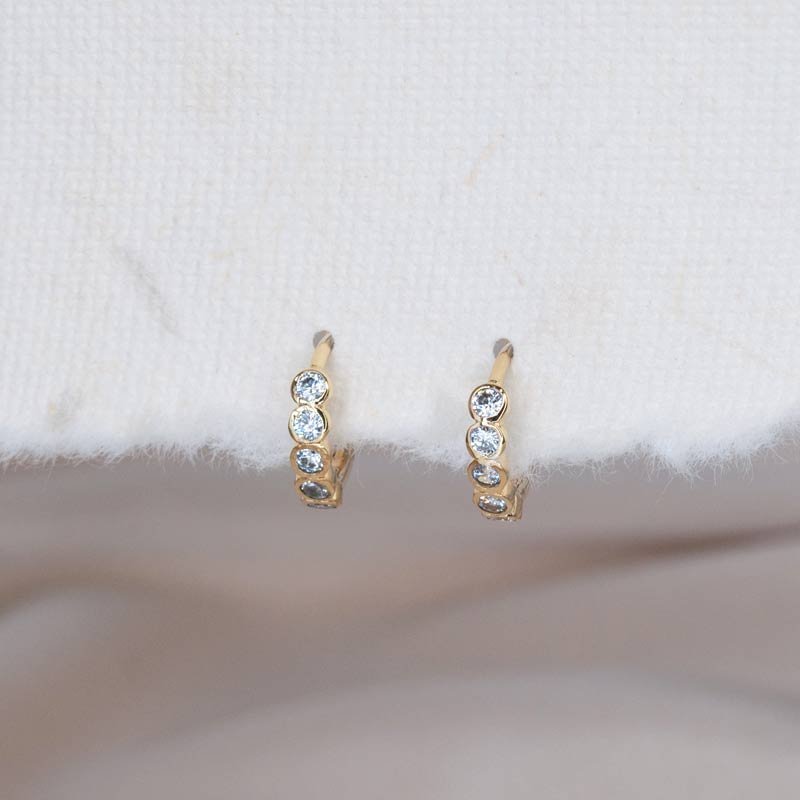 CZ gold huggie hoop earrings — minimalist gold hoops with sparkle