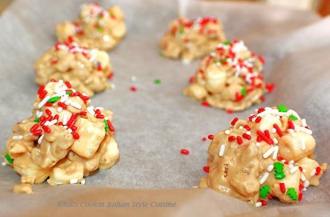 White chocolate peanut butter Krispies drying on a cookie sheet