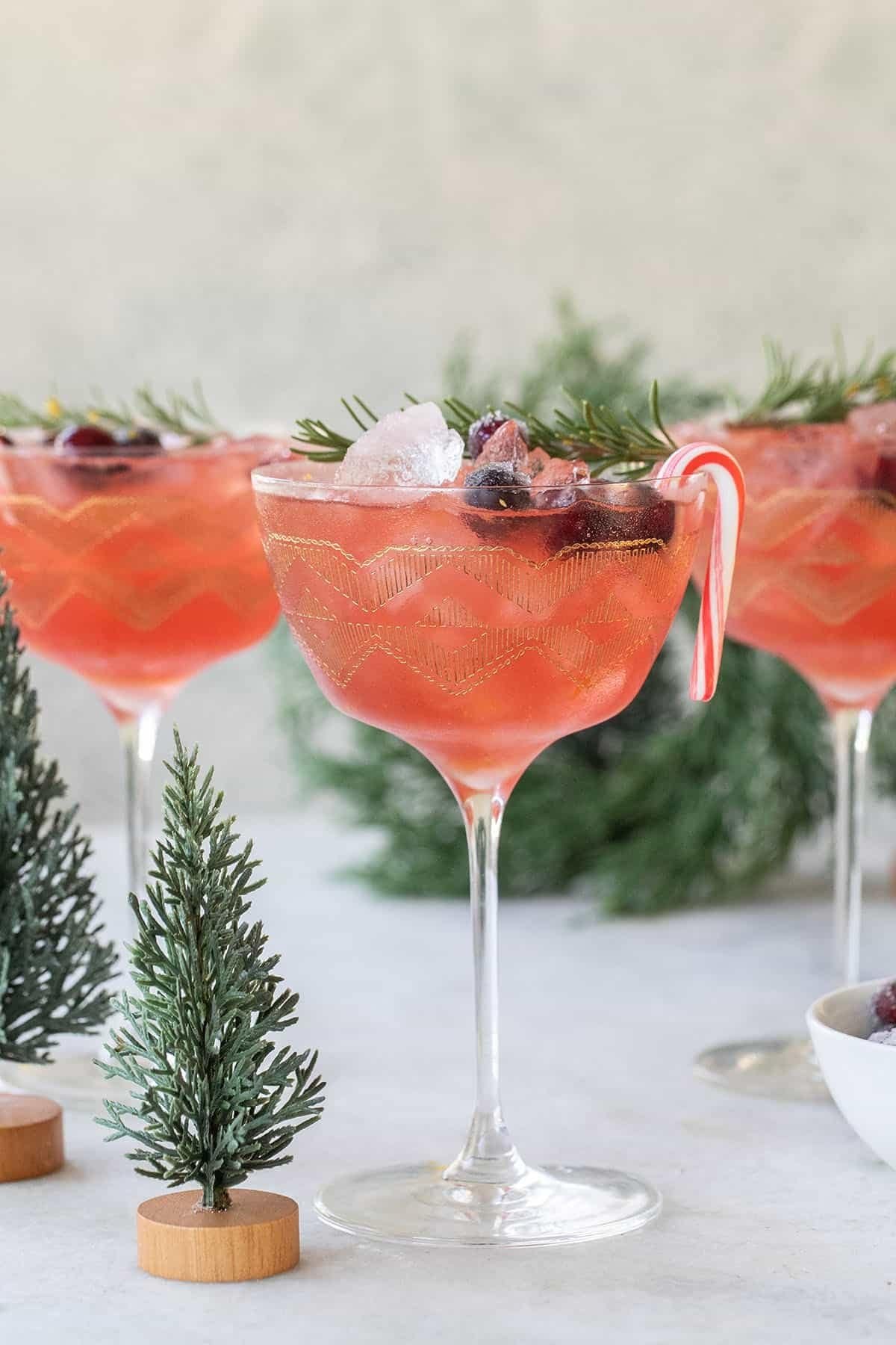 Christmas martini with sugared cranberries and orange zest — elegant holiday drink