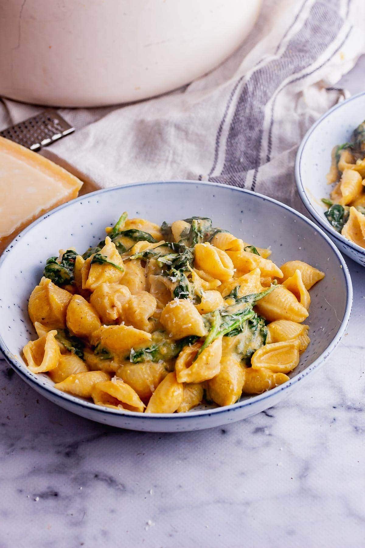 Creamy butternut squash pasta sauce served with herbs and warm autumn flavors