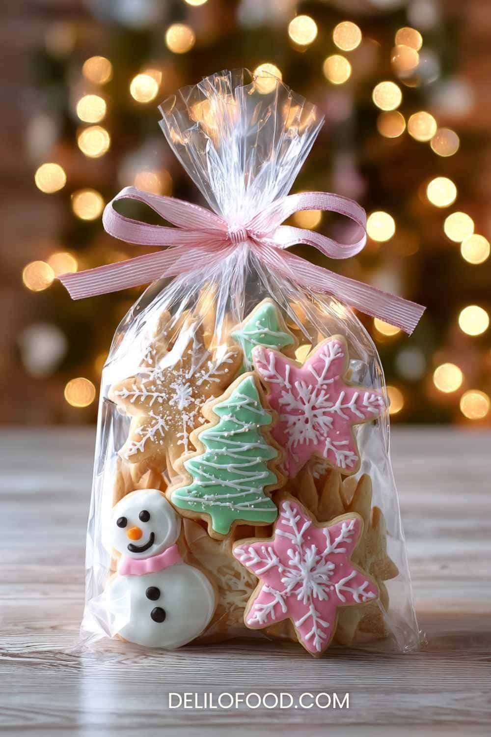 Colorful Christmas sugar cookies decorated with icing, including trees, snowflakes, and festive shapes on a holiday table