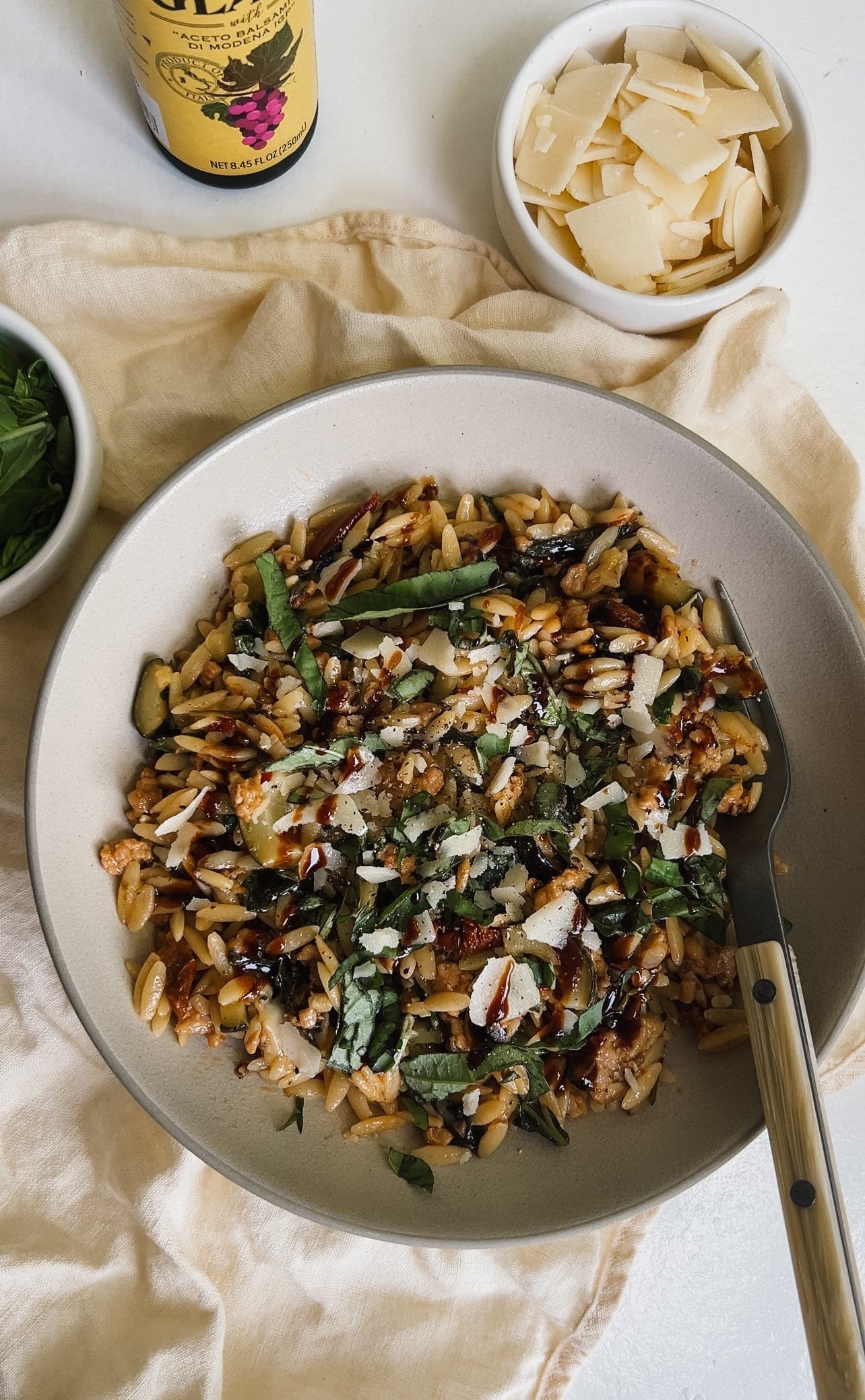 One-pot sausage and veggie orzo in a skillet