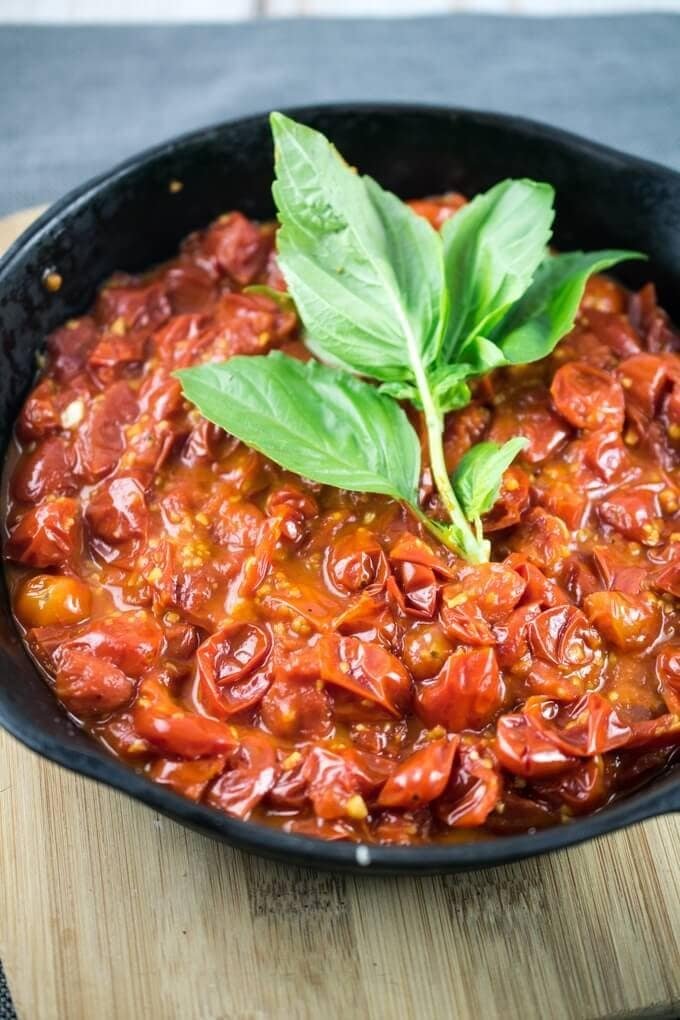 Fresh burst cherry tomato pasta sauce with garlic and basil