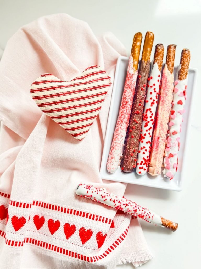Chocolate-dipped pretzel rods decorated for Valentine’s Day