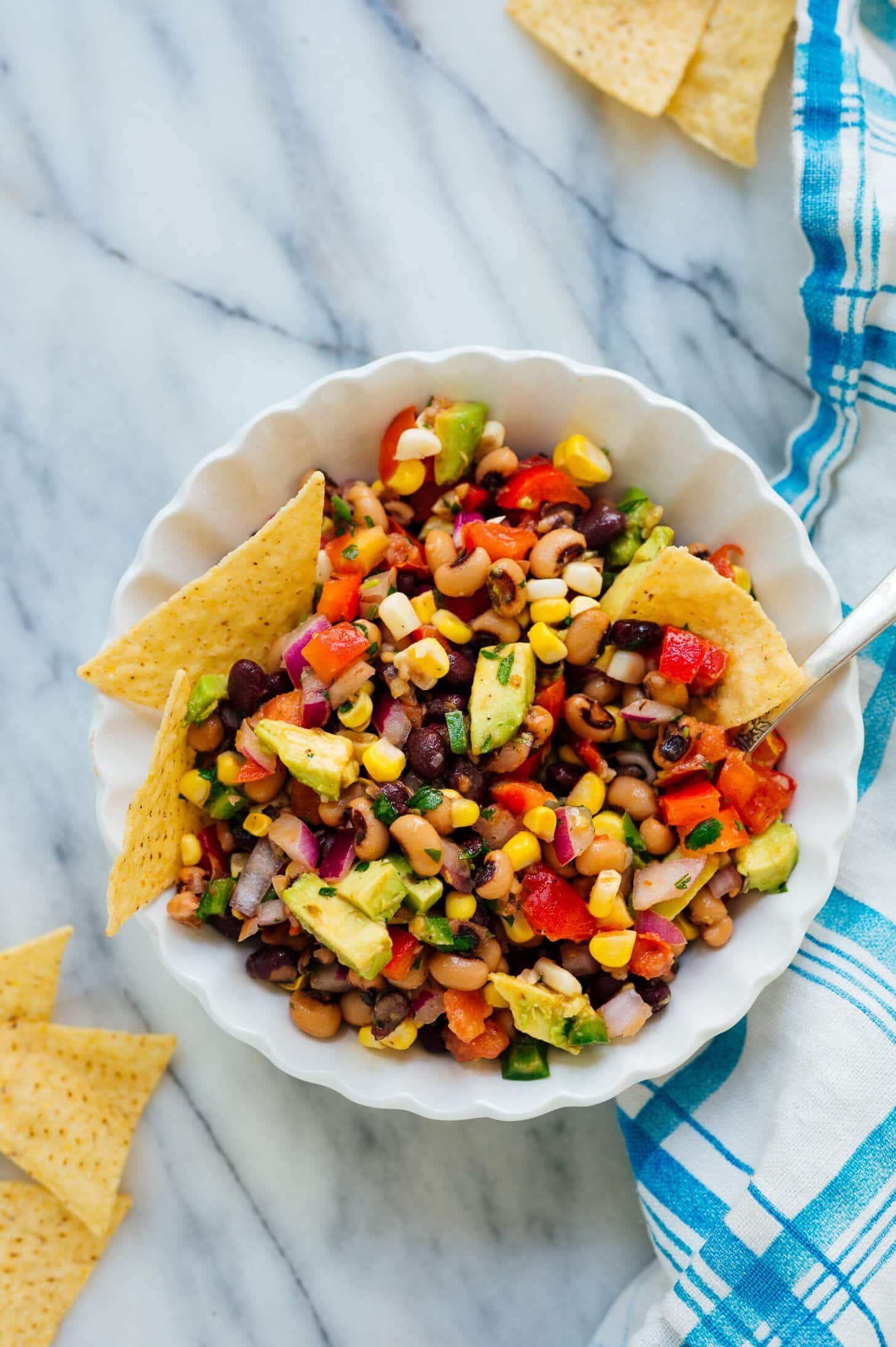 Cowboy caviar bean salsa in a bowl with chips for dipping.