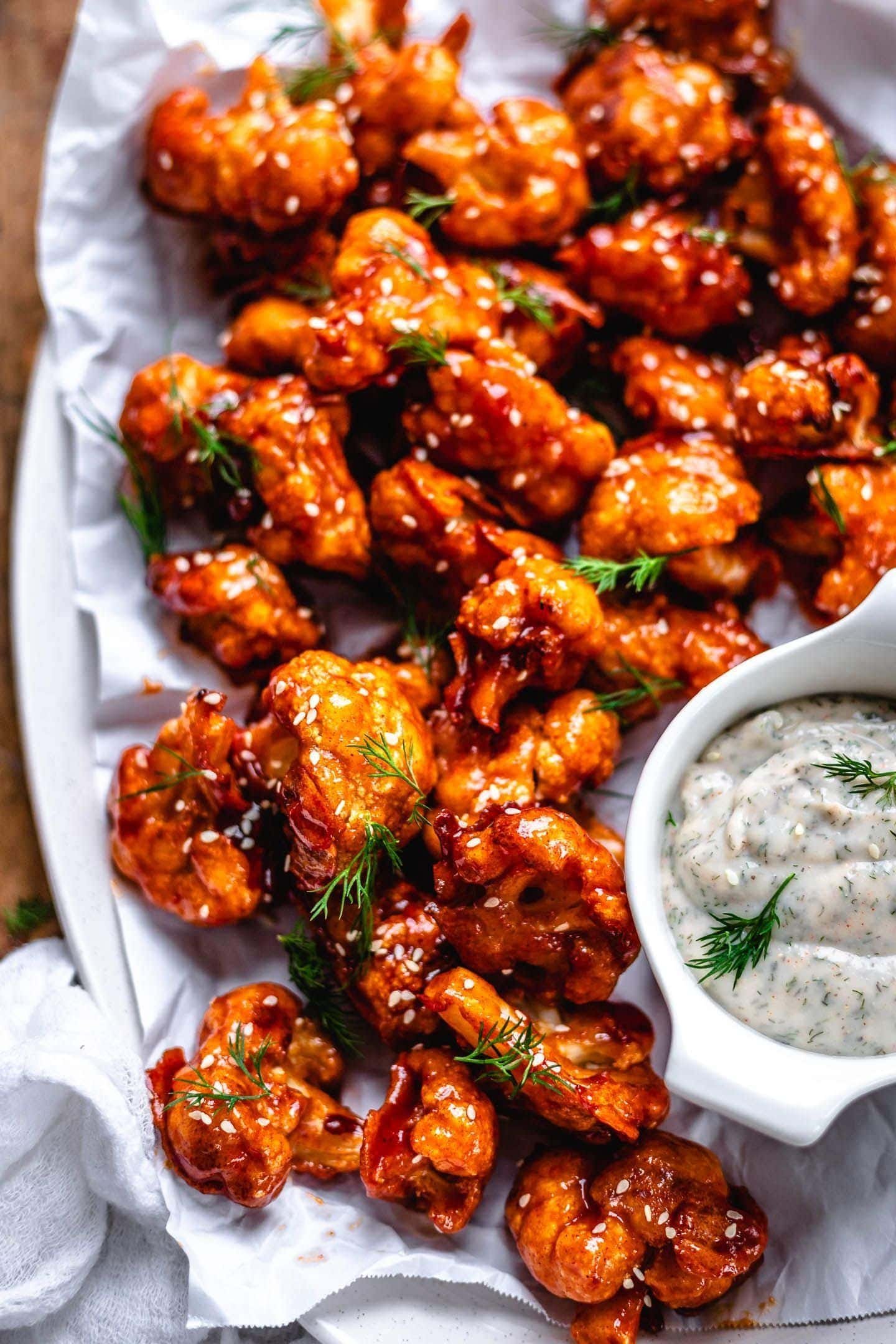 Buffalo cauliflower wings served with creamy dip.