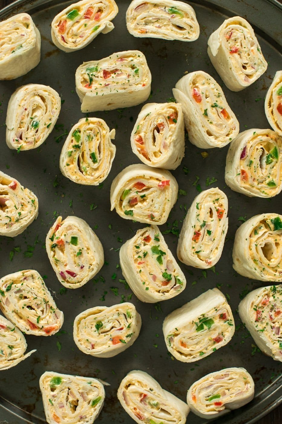 Vegan tortilla pinwheels with colorful vegetable filling.