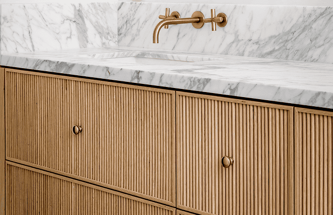 A bathroom sink with a marble countertop