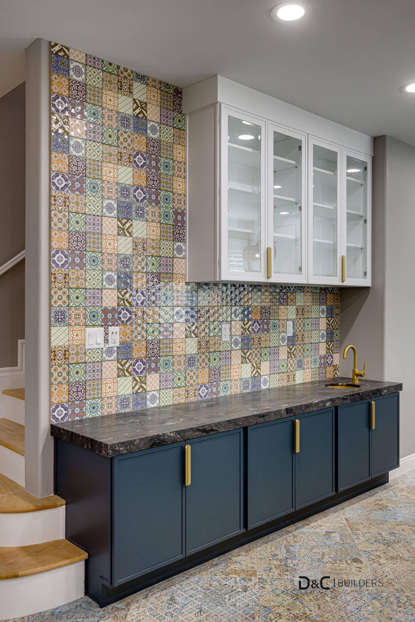 Compact bar station design with dark stone countertop and Moroccan-inspired tiles