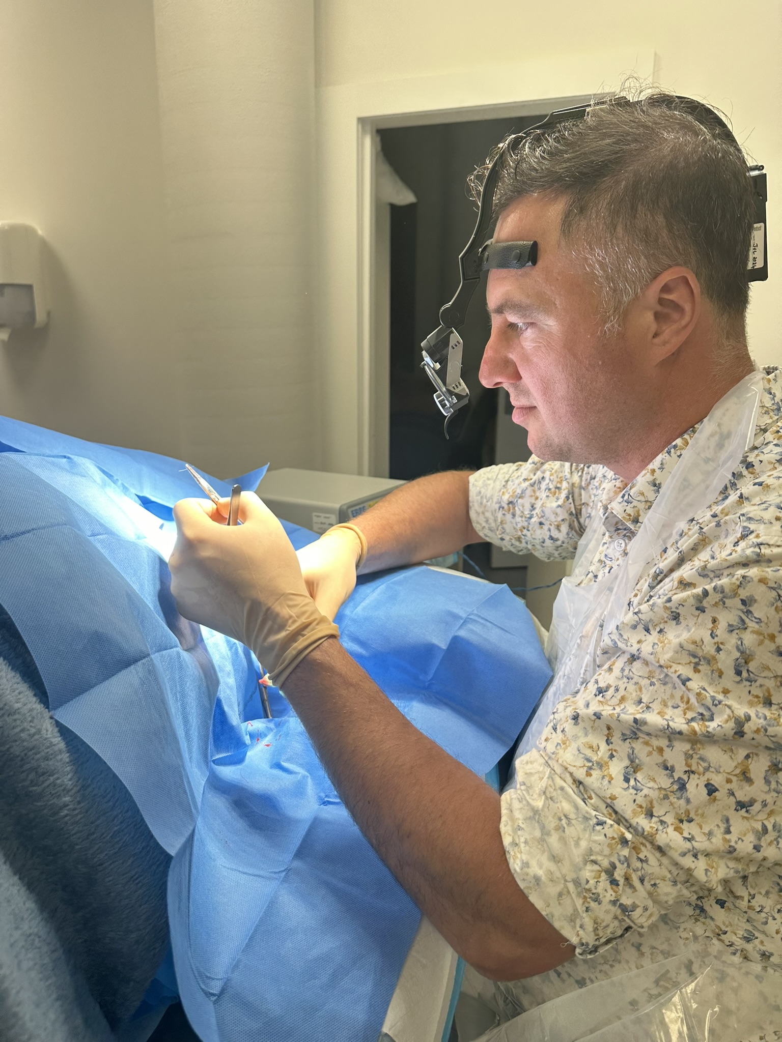 Dr Bulent Yaprak specialist plastic surgeon performing a procedure