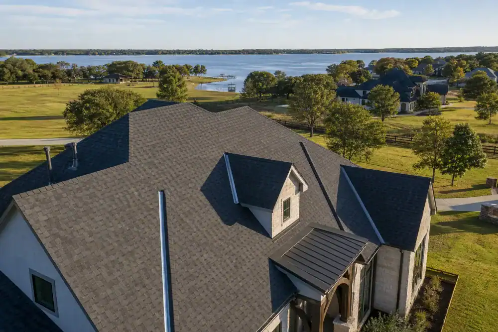 Suburban homes with shingled roofs in Oak Point, Texas