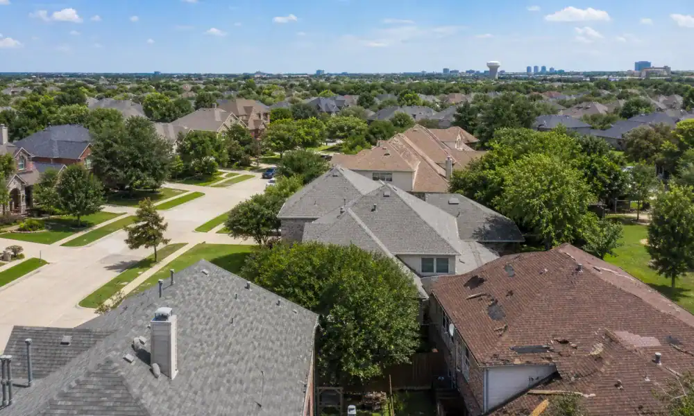 Residential street lined with homes in Plano, Texas