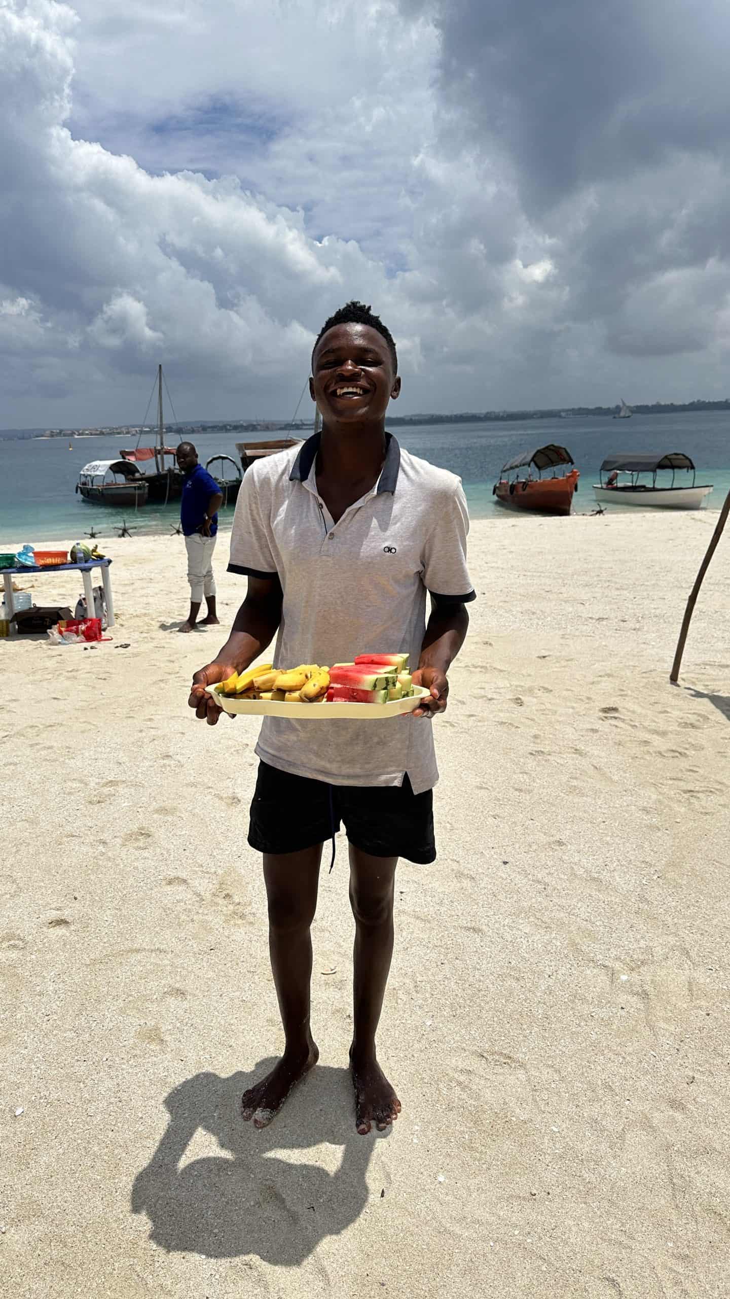 Our chef with fresh fruit for us