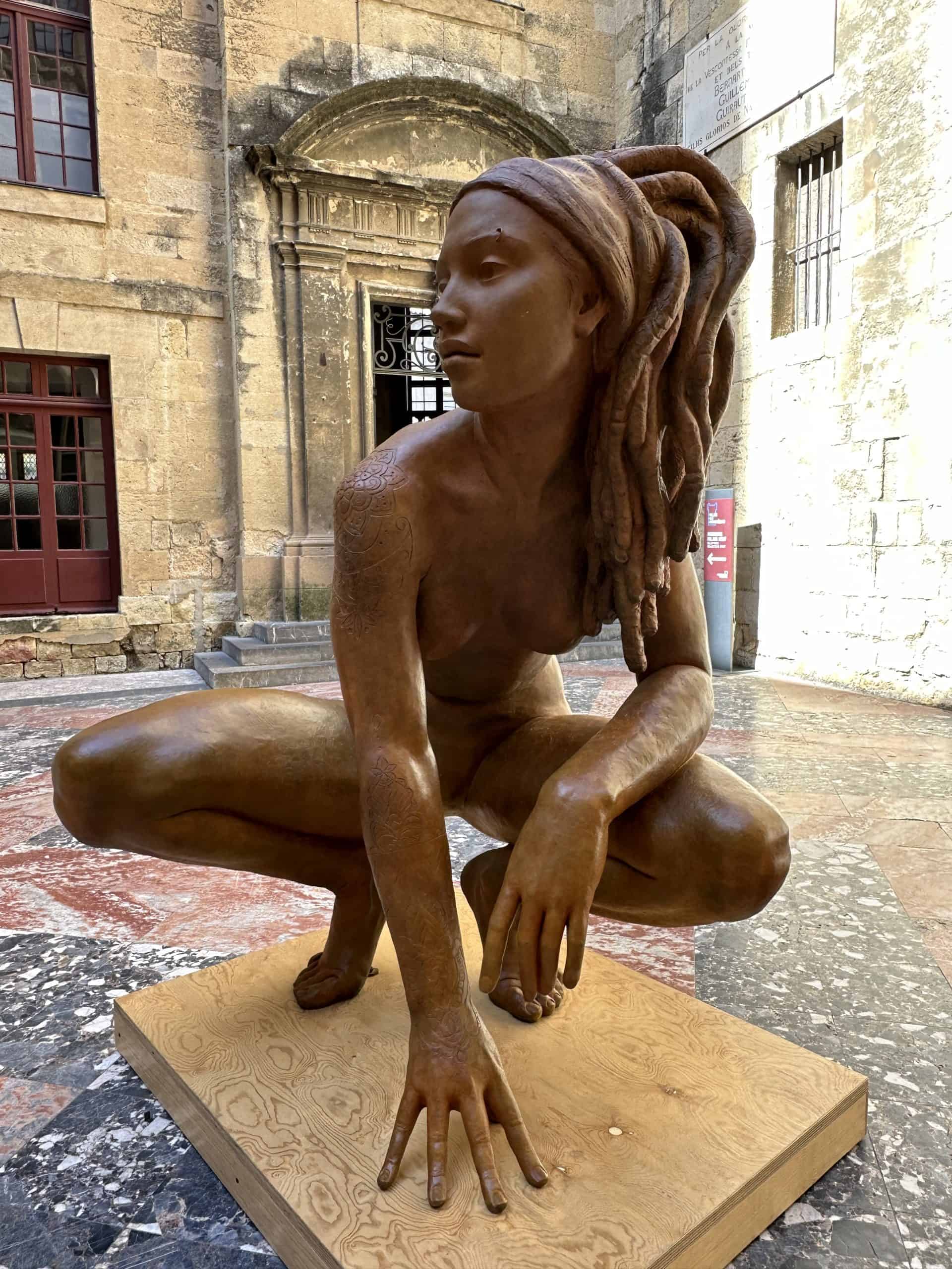 Sculpture of woman in warrior pose