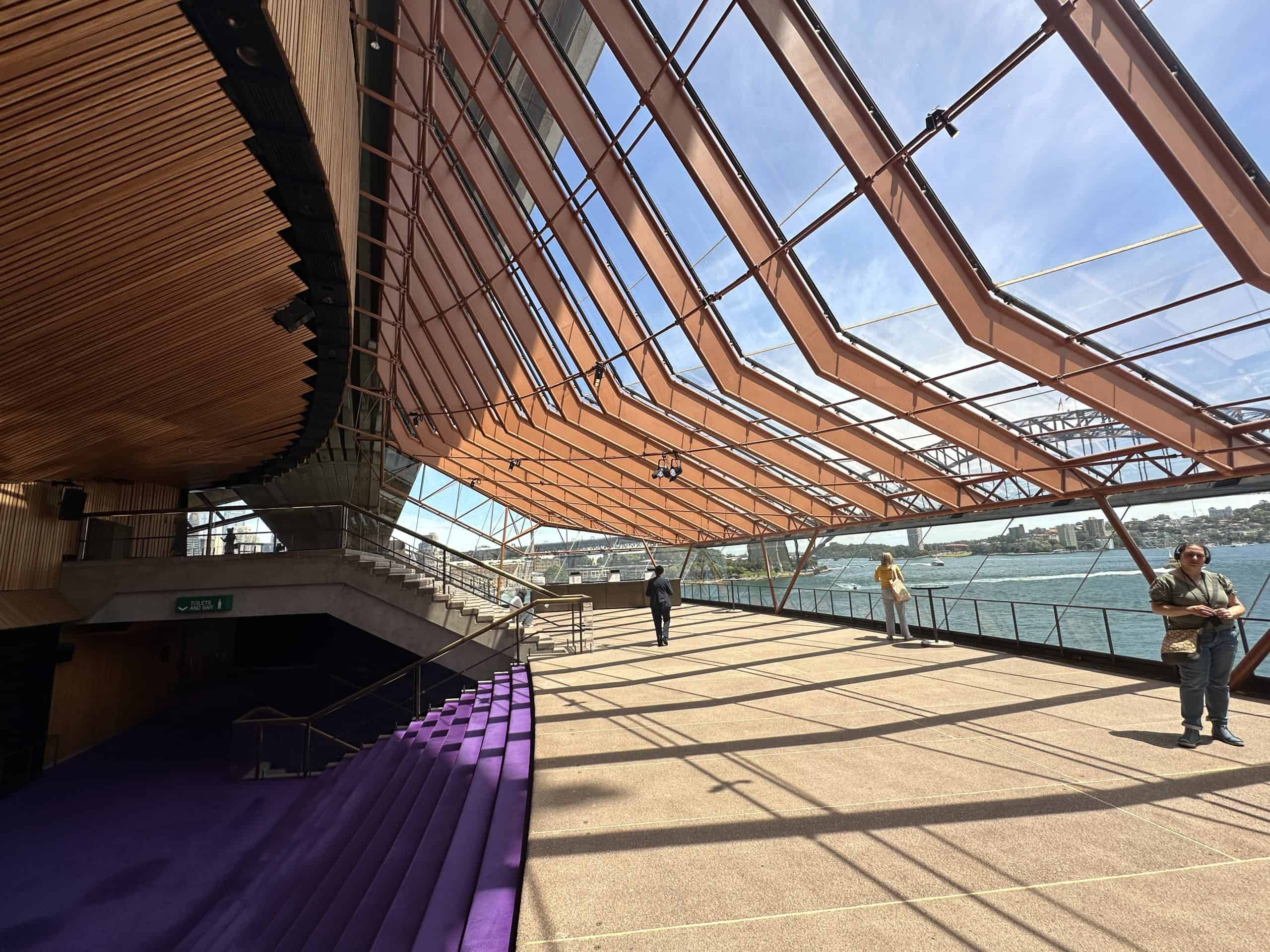 Glass panes of the Sydney Opera House with views over the harbour