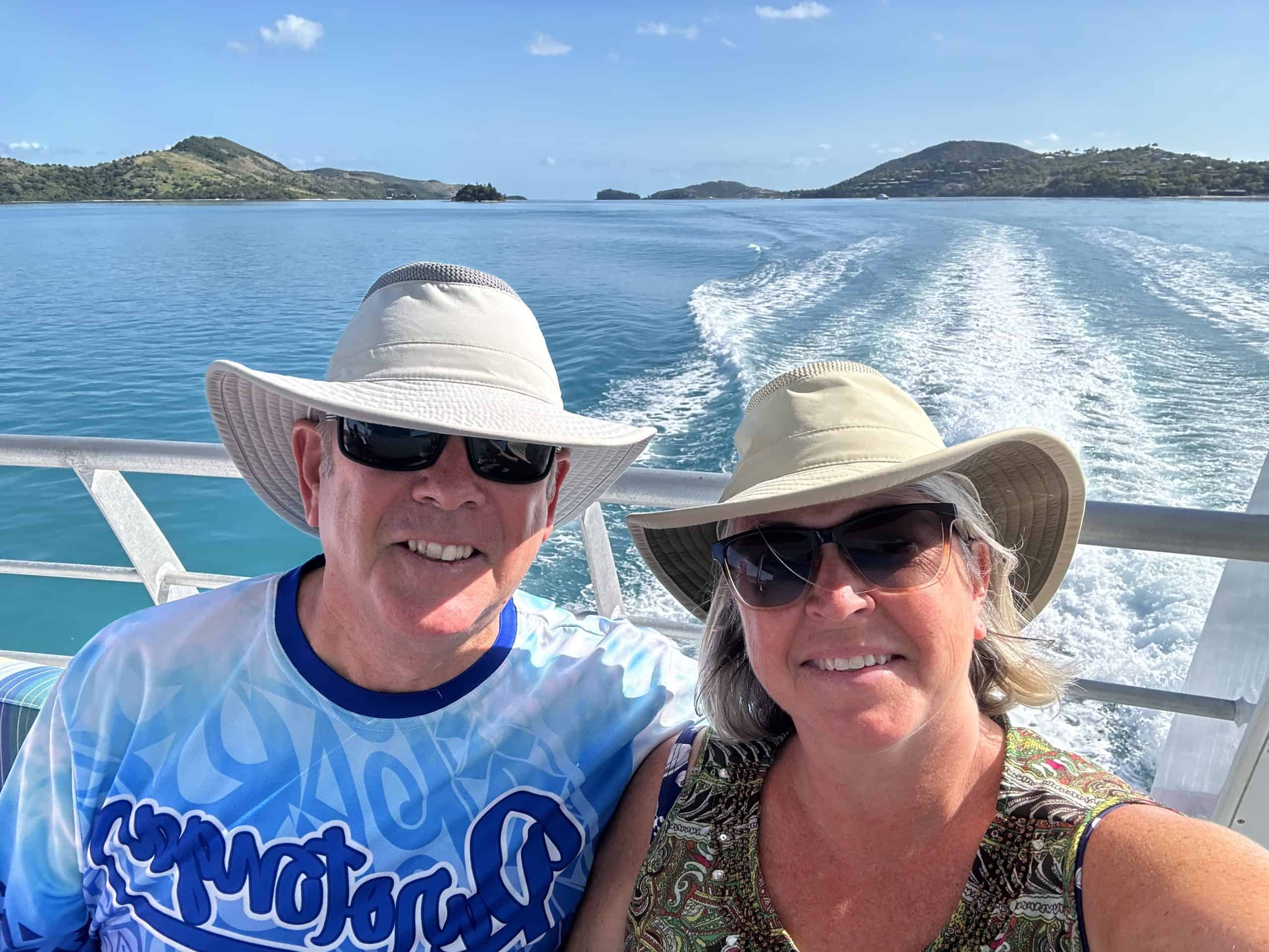 our selfie on a boat in front of hamilton island