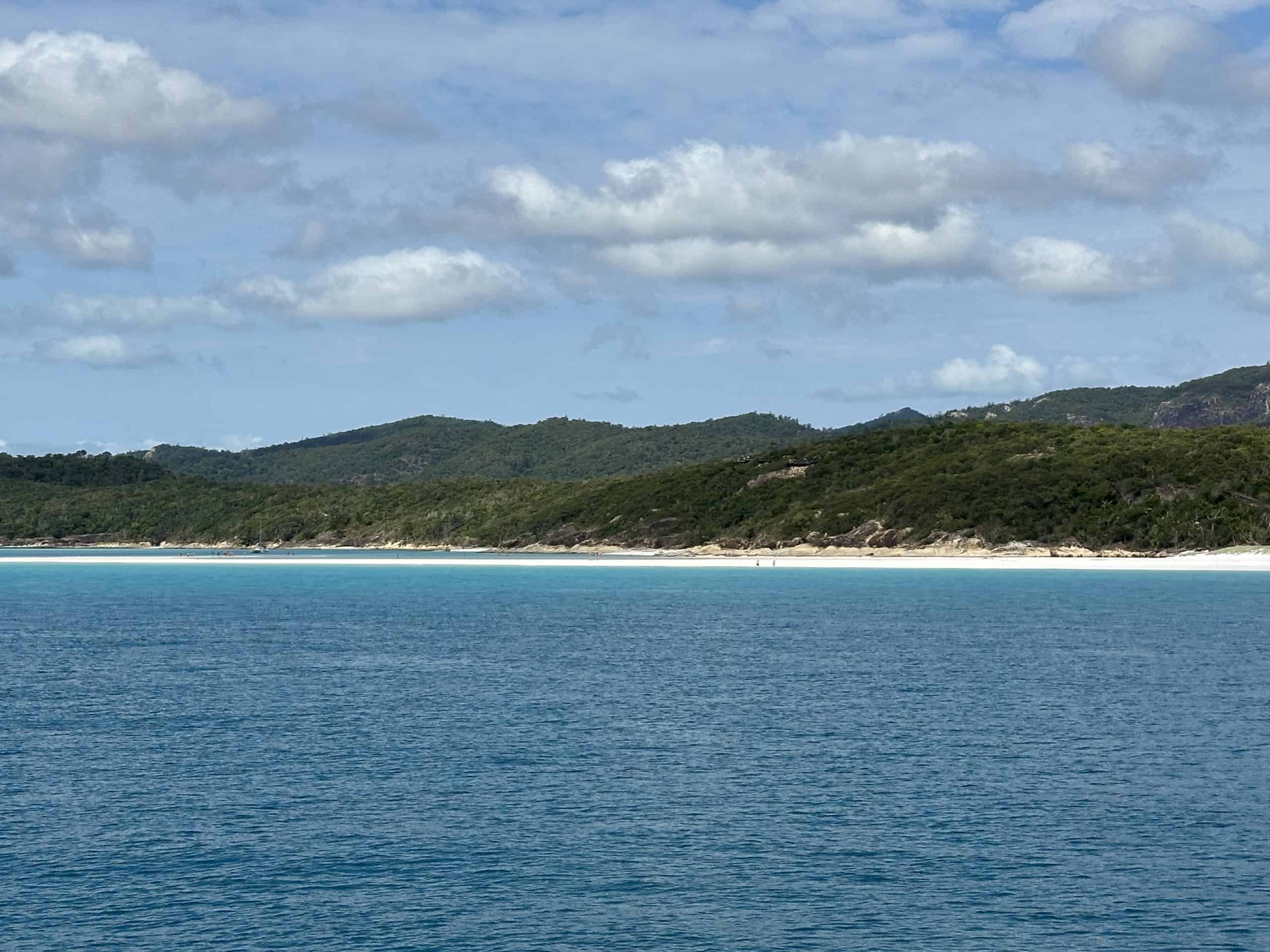 Looking at Whitehaven Beach from a boat on the water
