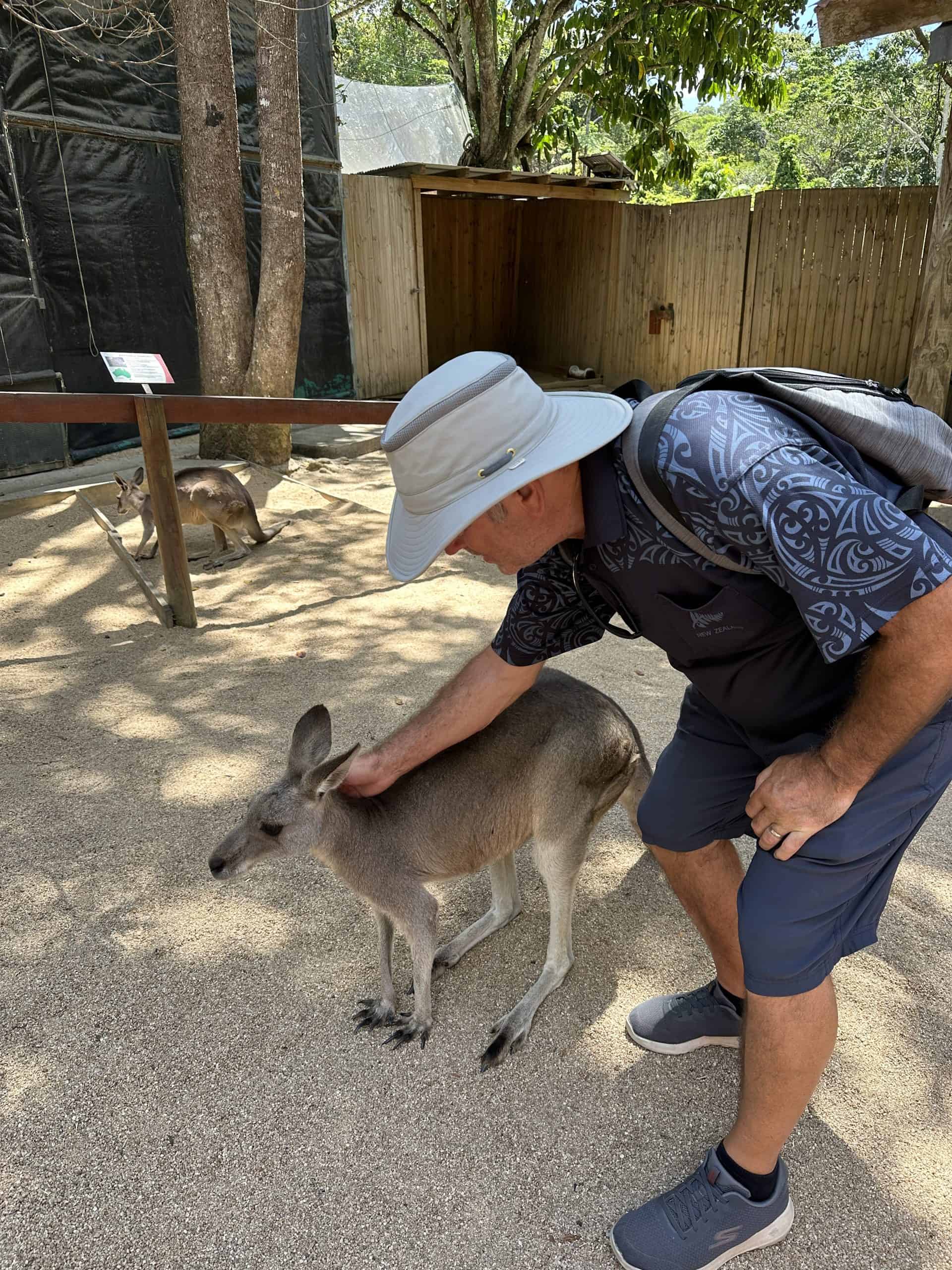 Denis patting a kangaroo - one of best the things to see in Kuranda