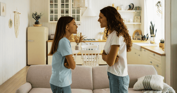 Mom and teen arguing in the living room
