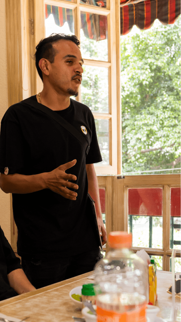 Food guide explaining taco history during Mexico City taco tour