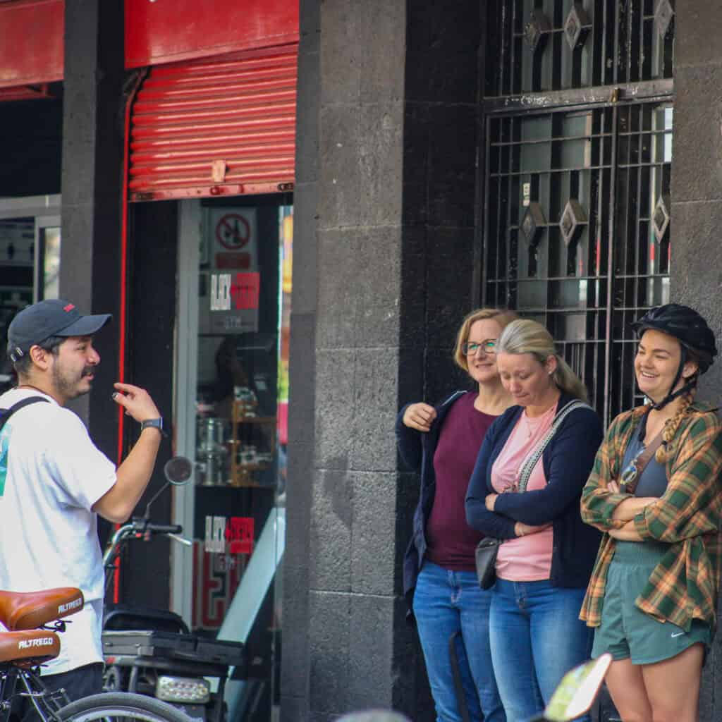 Guests at a small local food stall during the Mexico City bike tour.