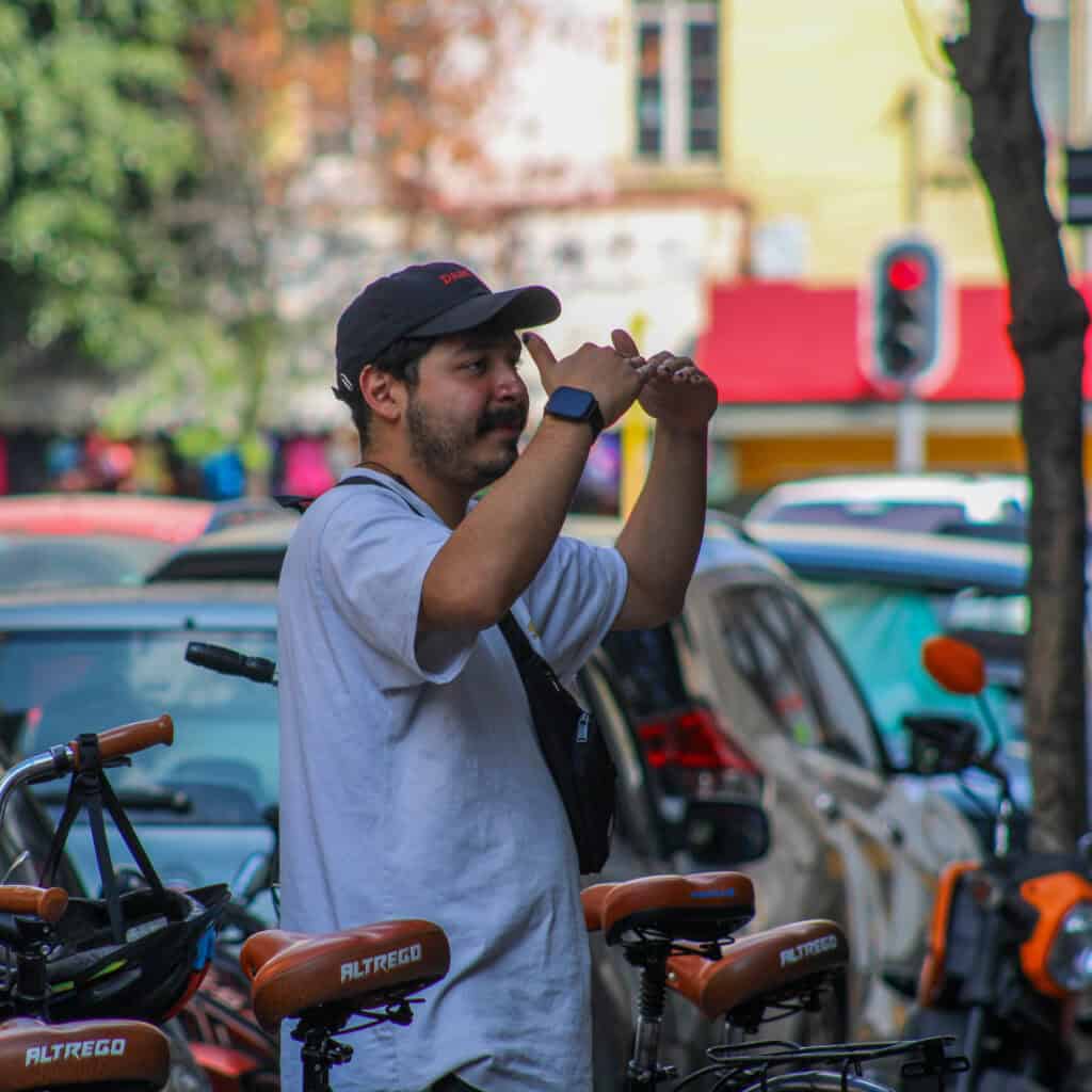 Travelers observing everyday life in Mexico City during Food Hood Tours.