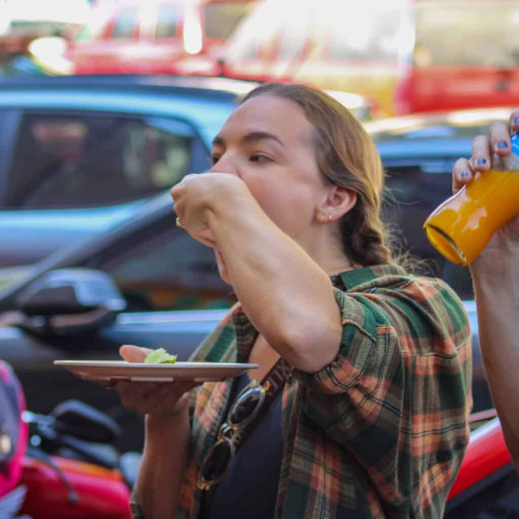 Travelers enjoying street food during a Mexico City bike tour with Food Hood Mexico