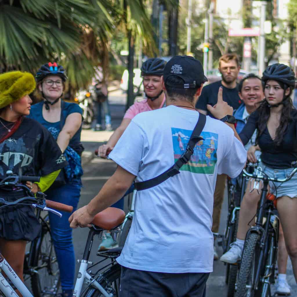 Guests visiting a tucked-away street food stand during the Mexico City bike tour