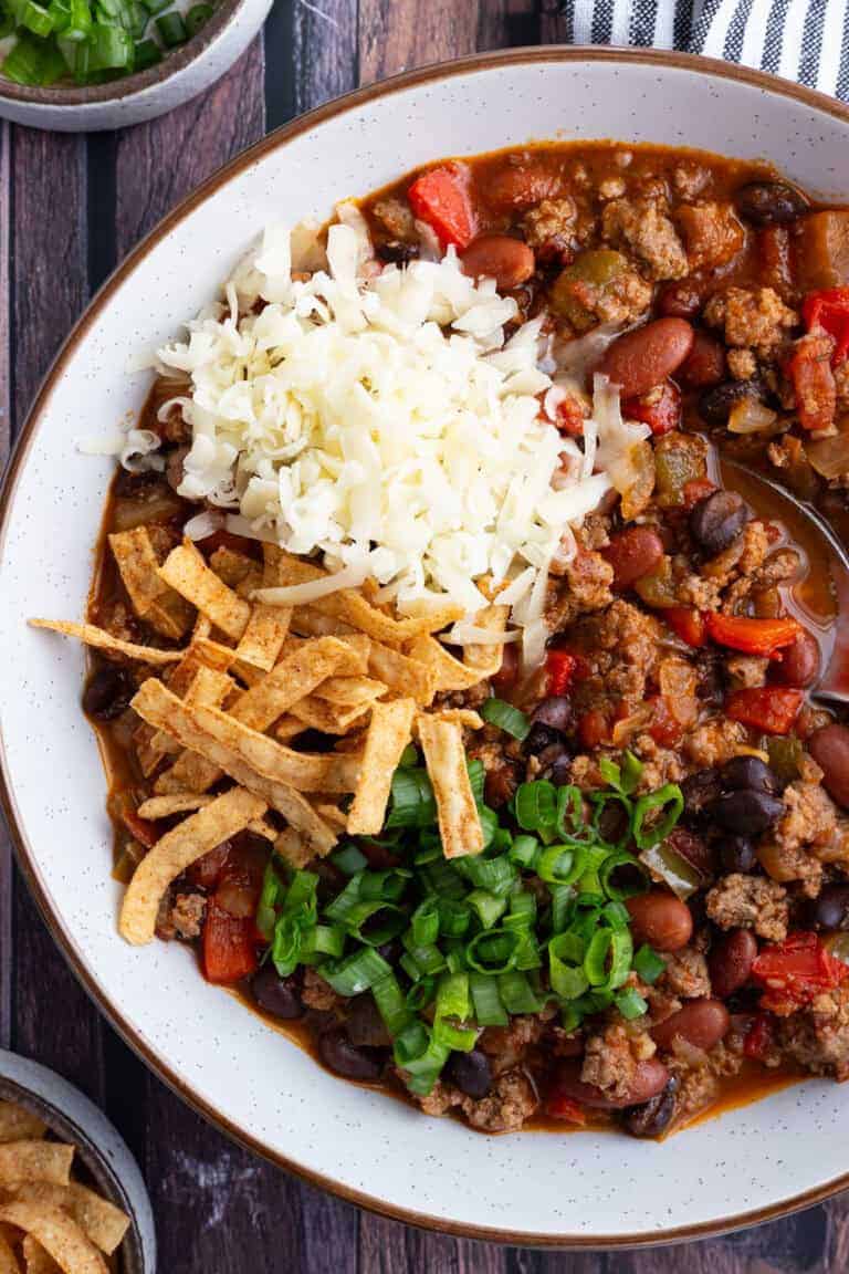 A bowl of spicy turkey chili with beans.