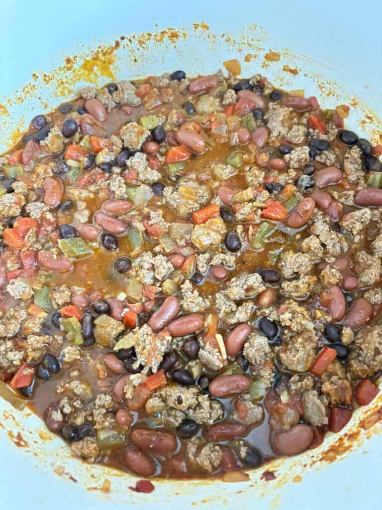 A finished pot of spicy turkey chili with beans.