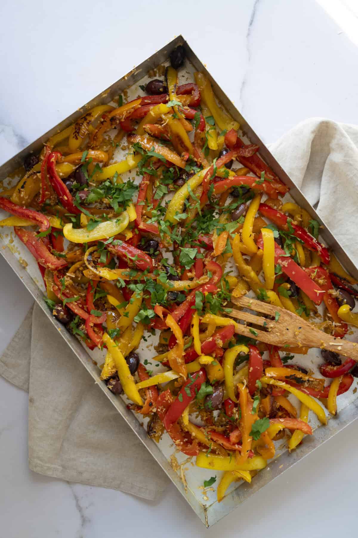 A pan of sweet peppers with olives.