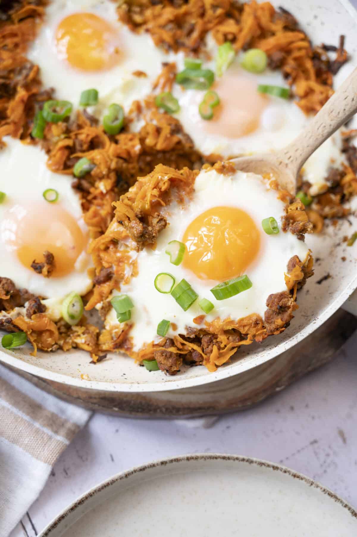 Baked eggs with chorizo and shredded sweet potato.