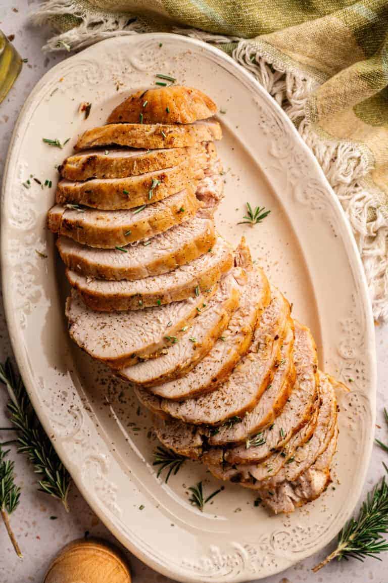 A platter of sliced turkey breast.