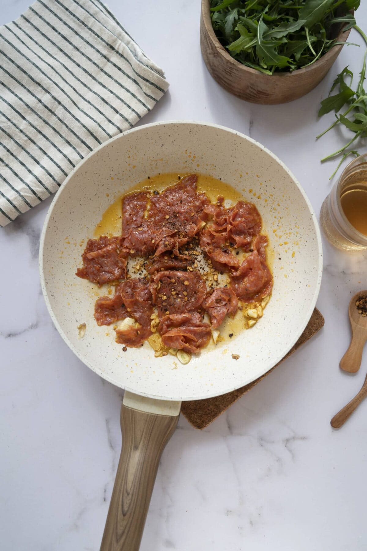 A pan of chorizo and red pepper flakes.