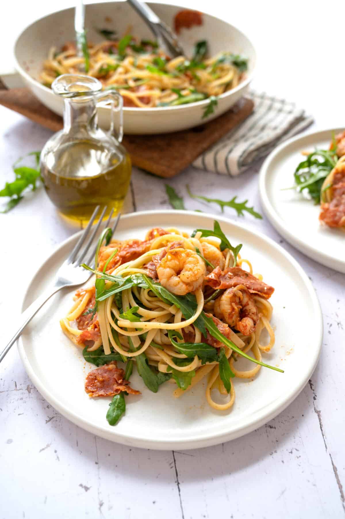 A plate of pasta with Spanish chorizo and shrimp.