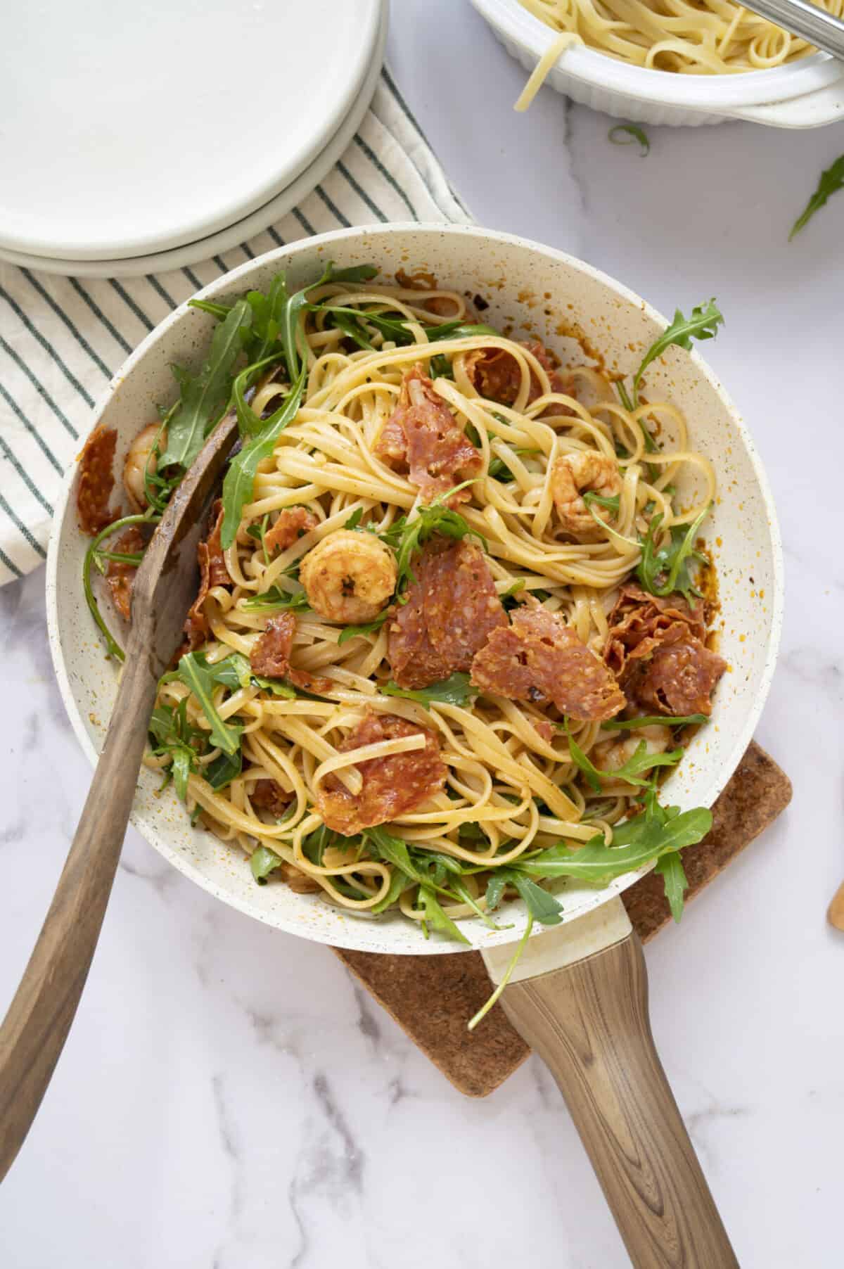 A pan of linguine tossed with shrimp and chorizo.