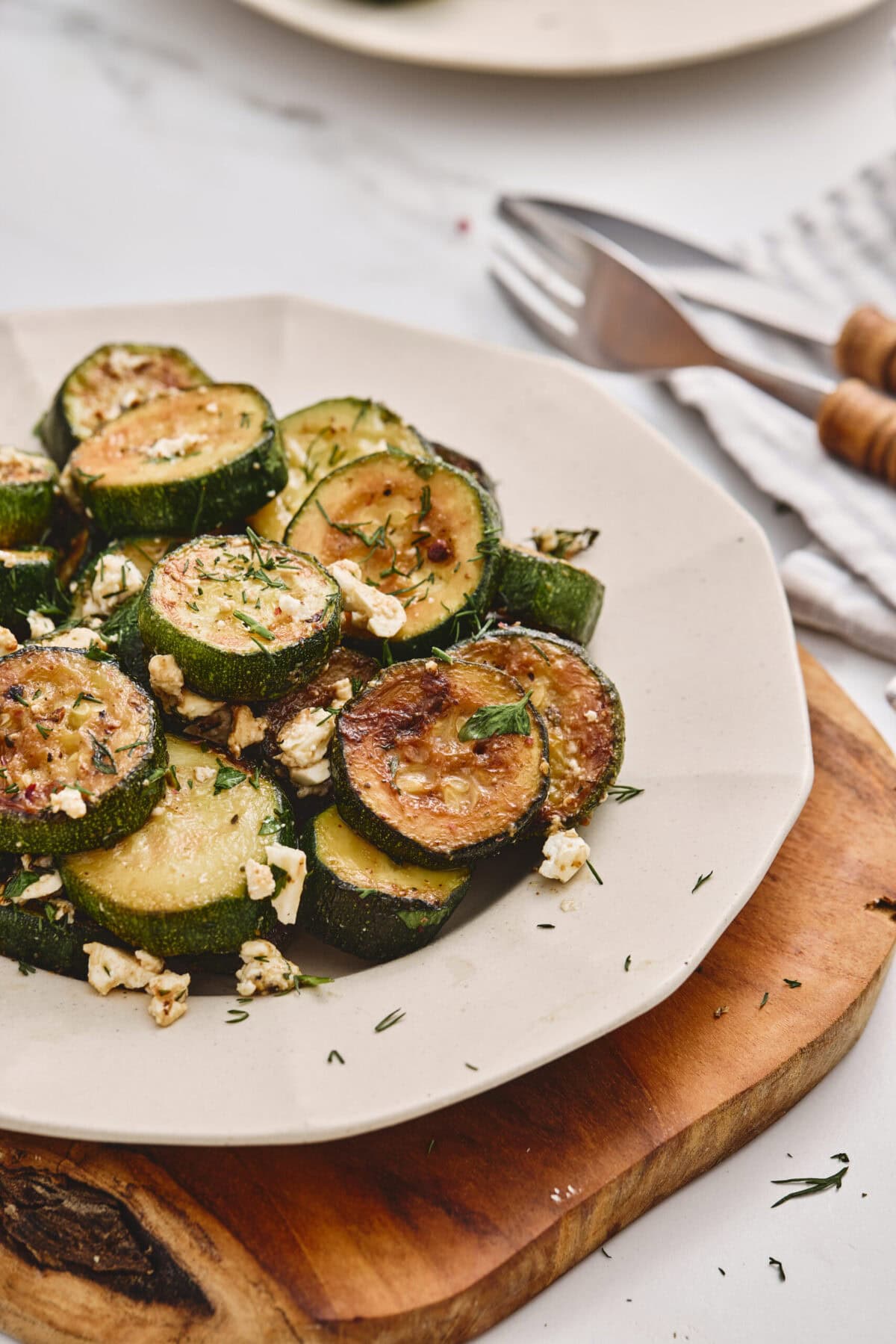 Zucchini and feta on a plate.