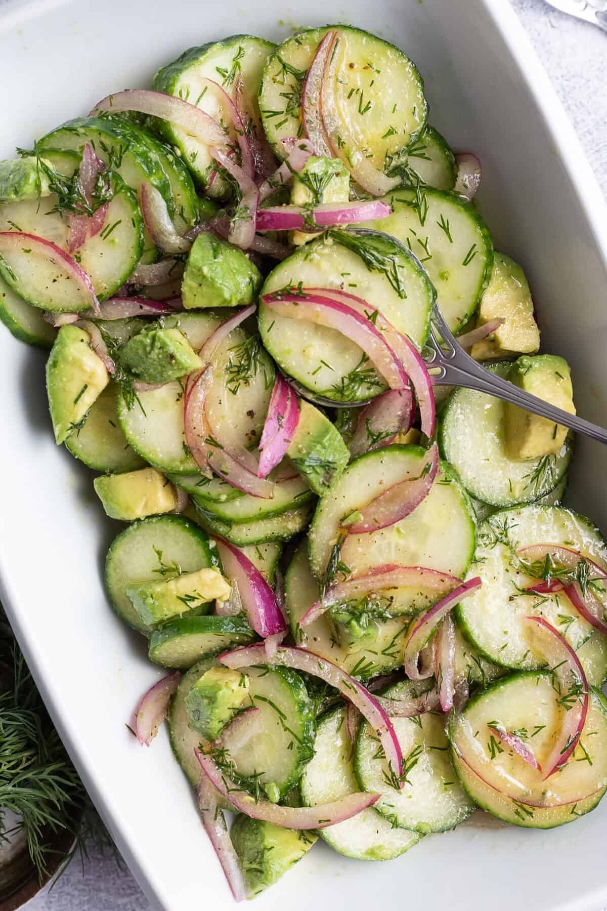 A crisp cucumber salad with dill and avocado.